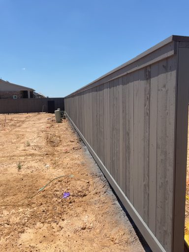 Commercial cedar fence staining project in Hockley TX by LRS Fencing & Gates