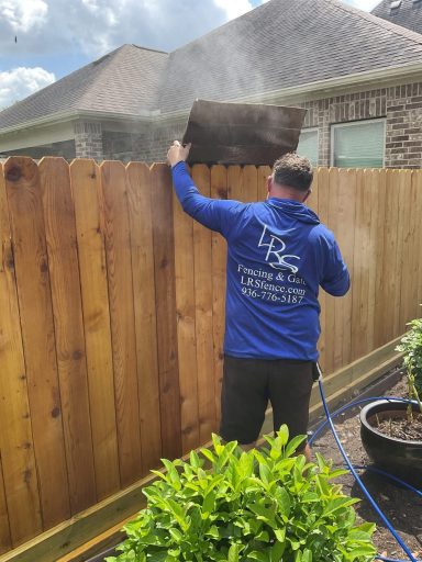 Professional fence staining project in Montgomery, Tx by LRS Fencing & Gates